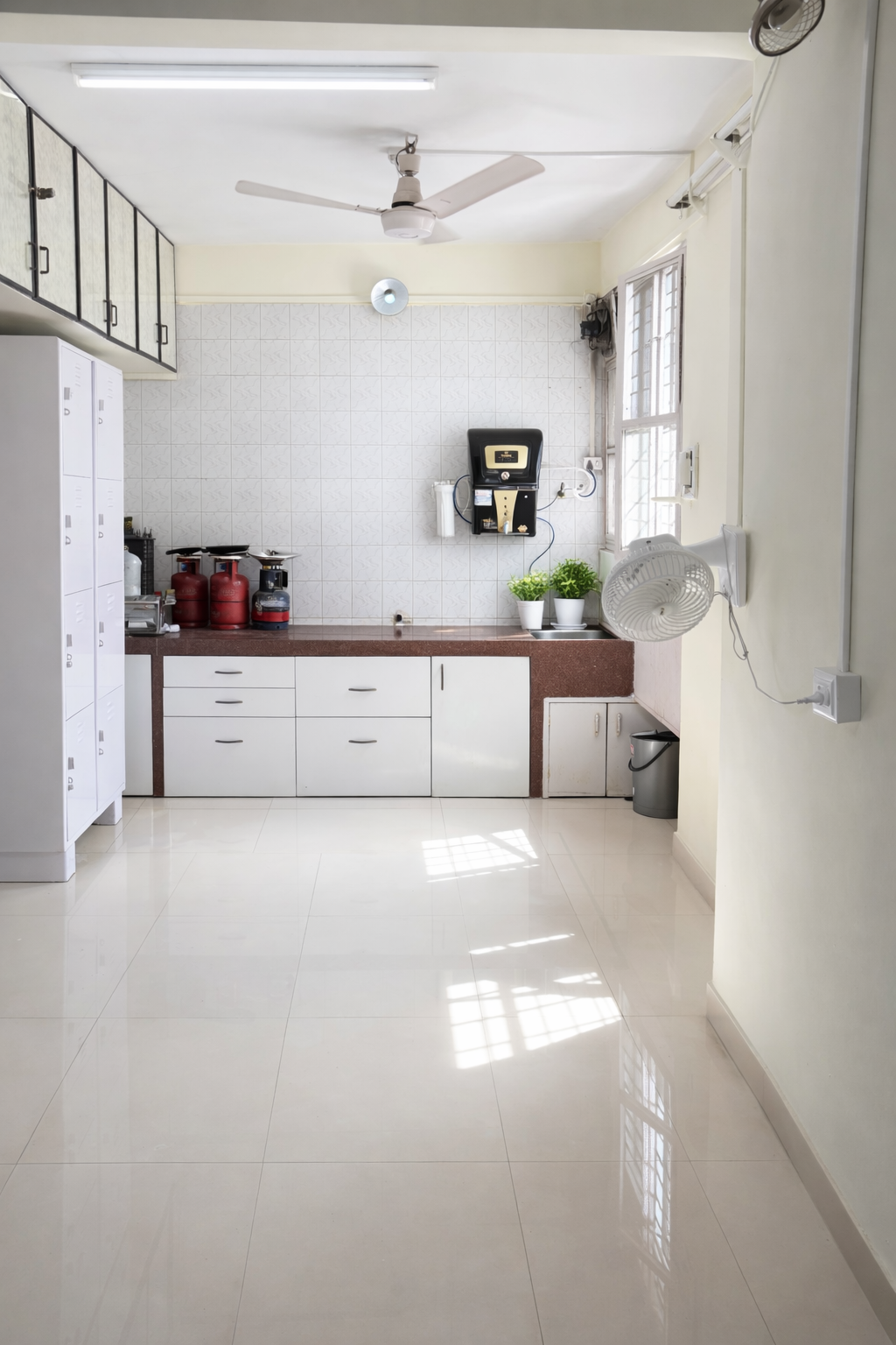 Bright Shared Kitchen Pantry with Modular White Cabinets